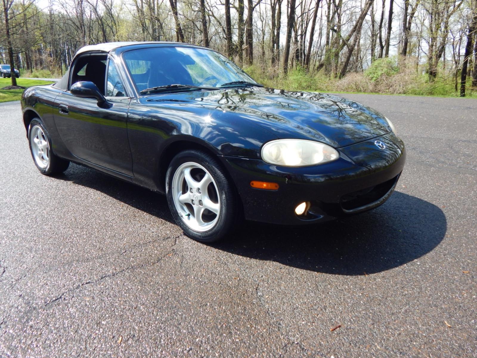 2002 Black /Black Cloth Mazda MX-5 Miata base (JM1NB353920) with an 1.8 liter 4 cylinder engine, 5 speed manual transmission, located at 6528 Lower York Road, New Hope, PA, 18938, (215) 862-9555, 40.358707, -74.977882 - Here for sale is a very fun 2002 Mazda MX-5 Miata. Under the hood is a strong running 1.8 liter 4 cylinder which puts power to the rear wheels via a solid shifting 5 speed manual transmission. Features include; Black cloth interior, wood grain trim, cold AC, power windows, AM/FM/CD, heated rear wi - Photo #2